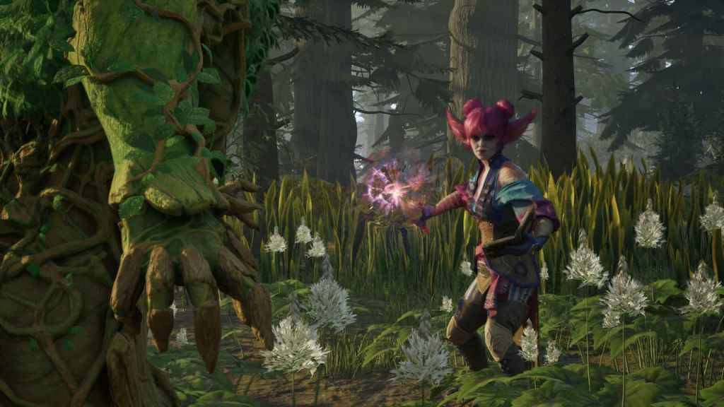Avowed, a female character about to fire magic at a green, bulky creature that we see from behind.